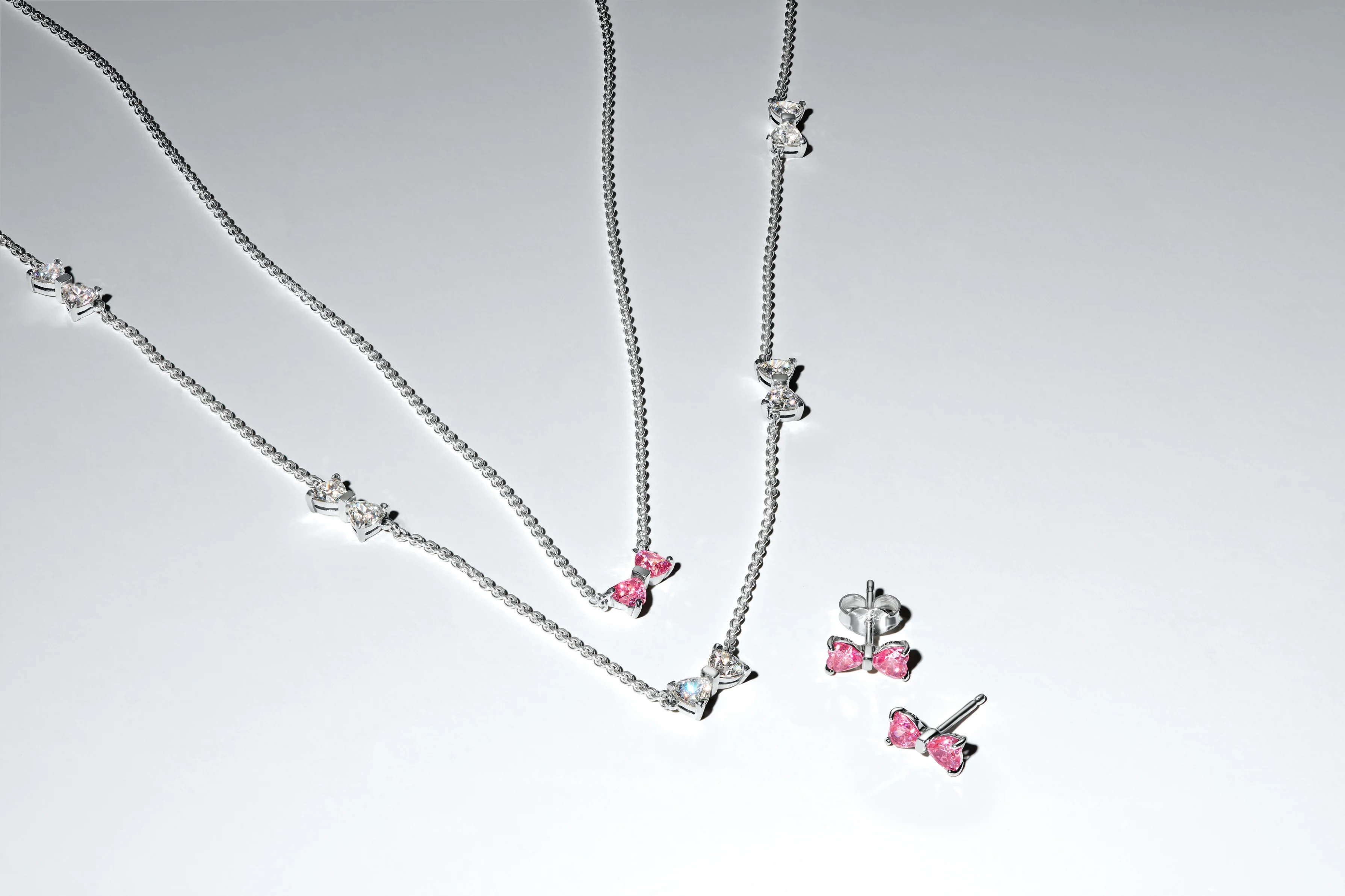 Bow Sterling Silver Stud Earrings With Fancy Pink And Clear Cubic Zirconia - Image 3